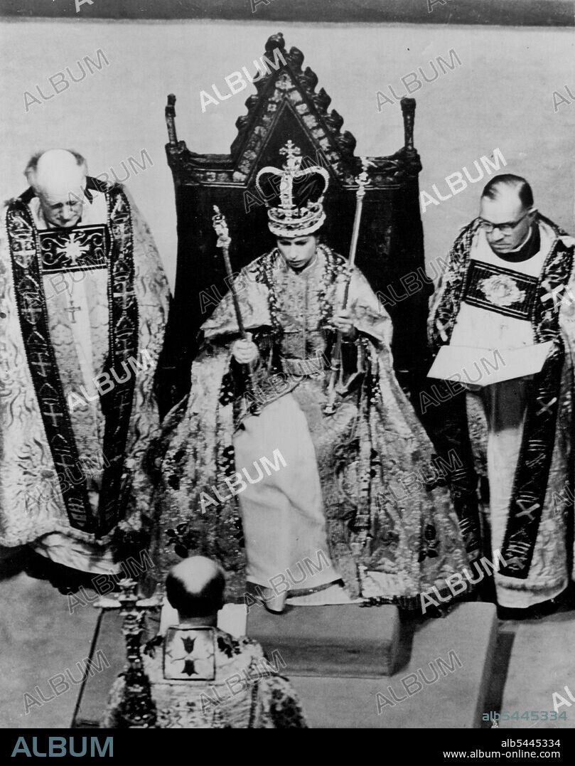 Coronation of Queen Elizabeth II -- Queen Elizabeth II seated in King Edward's Chair during the Coronation ceremony in Westminster Abbey. Facing her is the Archbishop of Canterbury. Over her long robe the Queen wears a cloth of gold. June 2, 1953. (Photo by Planet News Ltd.).