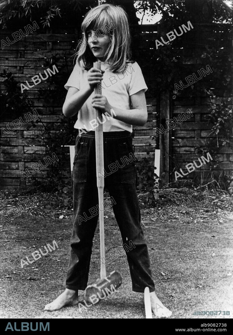 Lady Diana Spencer in the summer of 1970, barefoot, gripping a mallet during a game of croquet at Itchenor West Sussex.