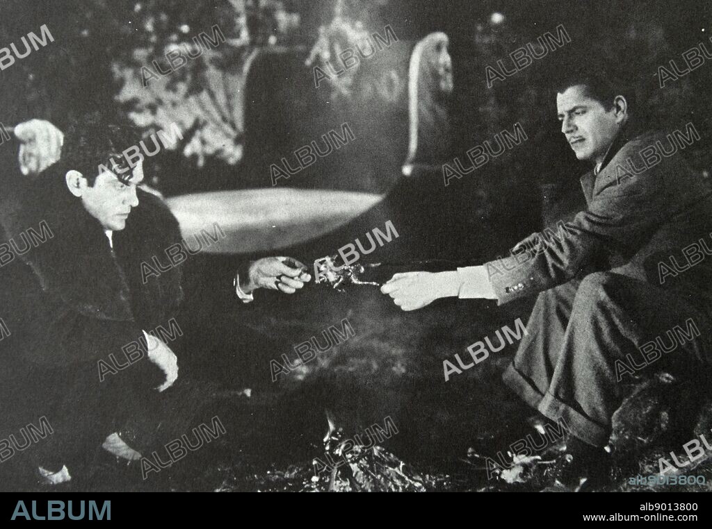 One More Spring', 1935. Jobless singer Walter Woolf King and penniless producer Warner Baxter, delicately roast a partridge in their new home, Central Park.