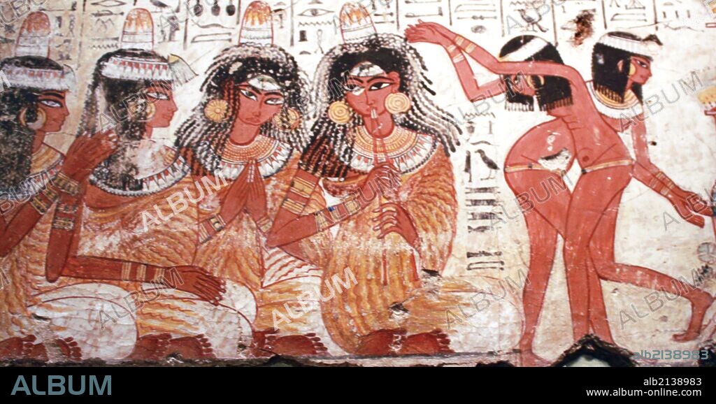 A feast for Nebamun. An entire wall of the tomb-chapel showed a feast in honour of Nebamun. Naked serving girls and servants wait on his friends and relatives. Married guests sit in pairs on fine chars, while the young women turn and talk to each other. This erotic scene of relaxation and wealth is something for Nebamun to enjoy for all eternity. The richly dressed guests are entertained by dancers and musicians, who sit on the ground playing and clapping (Photo by: Universal History Archive/UIG via Getty Images).