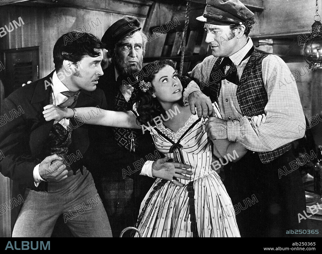 JOHN WAYNE, LYNNE OVERMAN, PAULETTE GODDARD and RAY MILLAND in REAP THE WILD WIND (1942), directed by CECIL B DEMILLE. Copyright PARAMOUNT PICTURES.