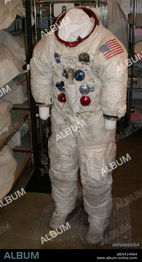 The names for both the Apollo and Skylab spacesuits were Extravehicular Mobility Unit (EMU). Apollo 11 made the A7L the most iconic suit of the program. and became the primary pressure suit worn by NASA astronauts for Project Apollo. On July 20, 1969, the Apollo 11 EMUs were prominent in television coverage of the first lunar landing.  The basic design of the A7L suit was a one piece, five-layer torso-limb suit with convoluted joints made of synthetic and natural rubber at the shoulders, elbows, wrist, hips, ankle, and knee joints. A shoulder cable/conduit assembly allowed the suit’s shoulder to move forward, backwards, up, or down with user movements. Quick disconnects at the neck and forearms allowed for the connection of the pressure gloves and the famous Apollo fishbowl helmet adopted by NASA as it allowed an unrestricted view.  A cover layer, which was designed to be fireproof after the deadly Apollo 1 fire, was attached to the pressure garment assembly and was removable for repairs and inspection. All A7L suits featured a vertical zipper from the helmet disconnect (neck ring), down the back, and around the crotch.