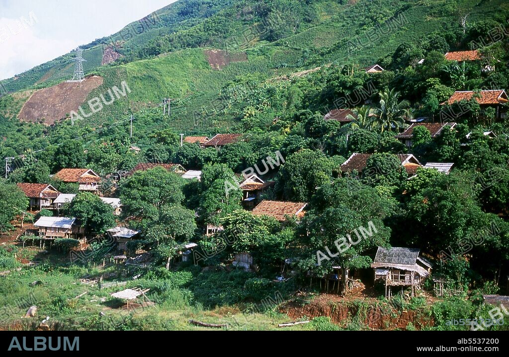 In the narrow mountain valleys of Son La, Dien Bien and Lai Chau provinces of North Vietnam the Tai remain a very noticeable and confident minority. They are divided into White Tai and Black Tai communities, while further south, by the Lao frontier in Thanh Hoa and Nghe An Provinces, Red Tai predominate. These subgroups are distinguished by the dress of their women. Vietnam’s Tai are people of the mountain valleys. Farming wet rice paddy fields they are relatively prosperous, enjoying more security and an appreciably higher standard of living than the people of the mountaintops. They are culturally confident, too, and well known throughout the north for their fine weaving and embroidery, sophisticated music and dance, as well as their business acumen in the marketplace. Closely related to the neighbouring Lao, Thai, Shan of Burma and Dai of China’s Yunnan Province, they have lived for centuries in the fertile uplands between the Truong Son and Hoang Lien ranges – certainly long before the region became part of Vietnam – and have a rich literary legacy and folklore.