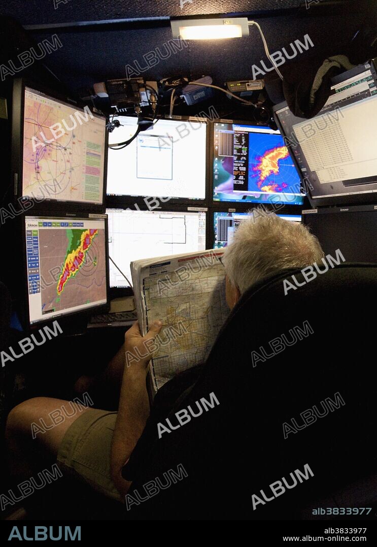Doppler on Wheels inventor Joshua Wurman monitors a bank of monitors while tracking severe weather in the Texas Panhandle on June 13, 2010. The DOW is one of several research vehicles that participated in VORTEX 2, an unprecedented two-year science project to study tornadoes in the United States in 2009 and 2010.