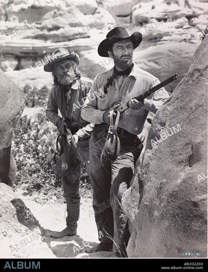 JOHN McINTIRE and ROBERT TAYLOR in AMBUSH, 1949, directed by SAM WOOD. Copyright M.G.M.