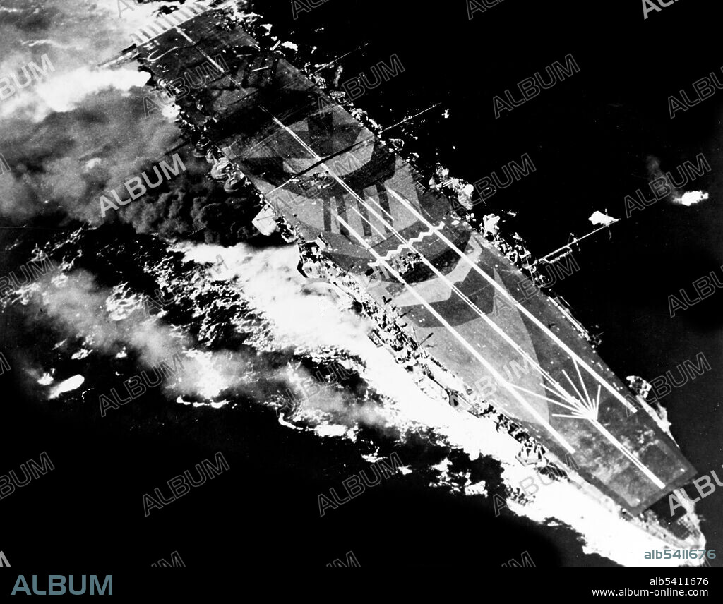 Japanese aircraft carrier Zuiho under attack by planes from USS Enterprise during the Battle off Cape Engano, October 25, 1944. The Battle of Leyte Gulf is considered to have been the largest naval battle of WWII and a contender for the title largest naval battle in history, with over 200,000 naval personnel involved. It was fought in waters near the Philippine islands of Leyte, Samar, and Luzon, from October 23-26 1944, between combined American and Australian forces and the Imperial Japanese Navy. This was the first battle in which Japanese aircraft carried out organized kamikaze attacks. (cropped and cleaned).
