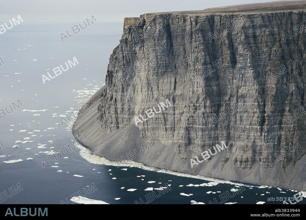 Cliffs of Devon Island, the largest uninhabited island on Earth,  in Baffin Bay, Qikiqtaaluk Region, Nunavut, Canada.