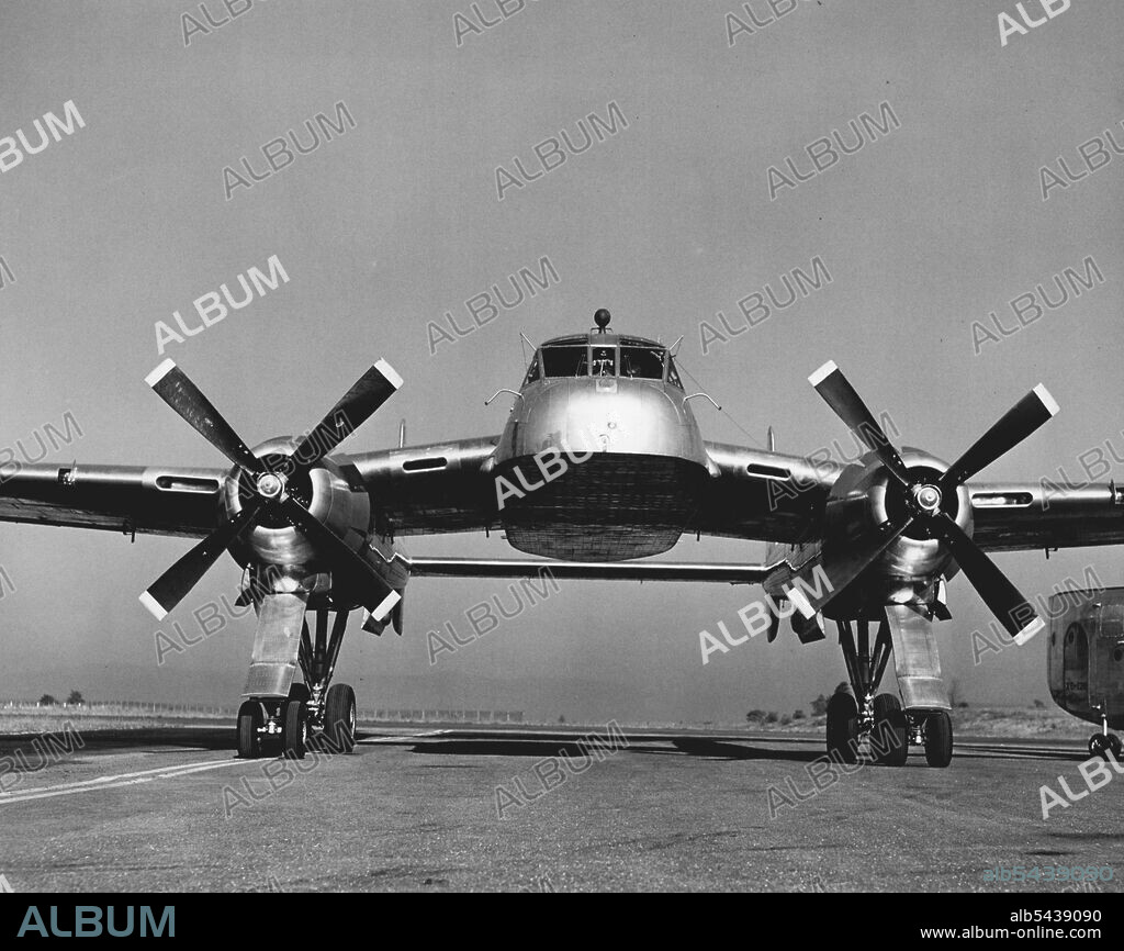 Minus its cargo-carrying detachable fuselage, the new Fairchild XC-120 Packplane taxis easily on its specially-designed quad- ricycle landing gear. The cargo compartment fits beneath the plane, held in place by four centrally-placed connections. October 01, 1950. (Photo by Dan Frankforter, Fairchild Aircraft).;Minus its cargo-carrying detachable fuselage, the new Fairchild XC-120 Packplane taxis easily on its specially-designed quad- ricycle landing gear. The cargo compartment fits beneath the p.