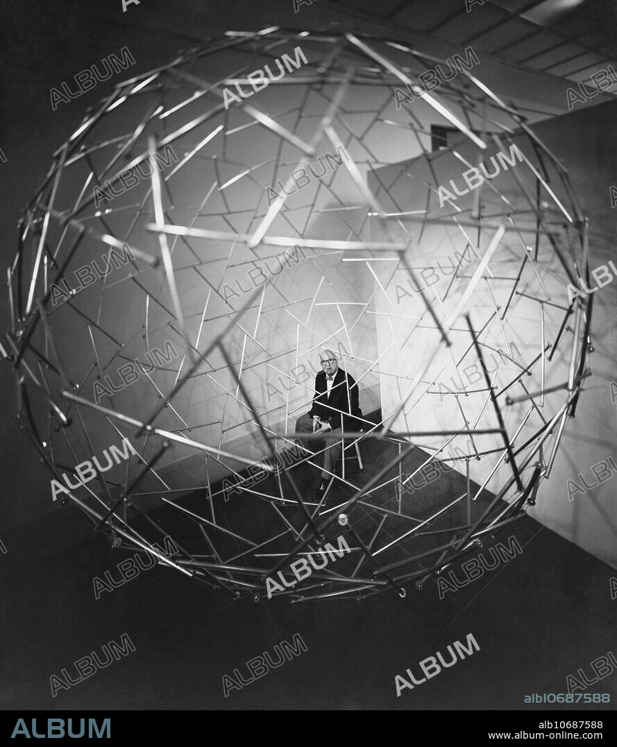 Editorial use only . Richard Buckminster 'Bucky' Fuller (July 12, 1895 - July 1, 1983) photographed in 1959 through a geodesic dome - a tensegrity hemisphere of 75 aluminum alloy struts and Monel wires at the Metropolitan Museum of Art in New York. This polyhedron based design structure was used to create the U.S. Pavilion at the World Expo in 1967 in Montreal, Canada.