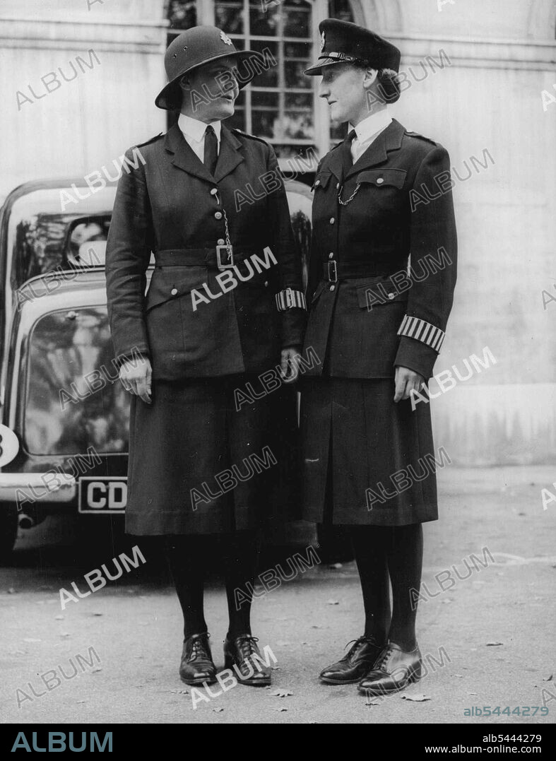 Smarter Uniforms For London's Women Police The old and the new. Policewomen wearing the present and newly approved uniforms at Scotland Yard to-day (Tuesday). A new uniform London's women police has been approved by the Home Office and Scotland Yard, and will be seen by the public in November. The new tunic has padded shoulders, higher lapels and two breast pockets in the style of those worn by the American women police. The detachable belt has a buckle of new design. The skirt is of six-piece design instead of two-piece. July 23, 1946.