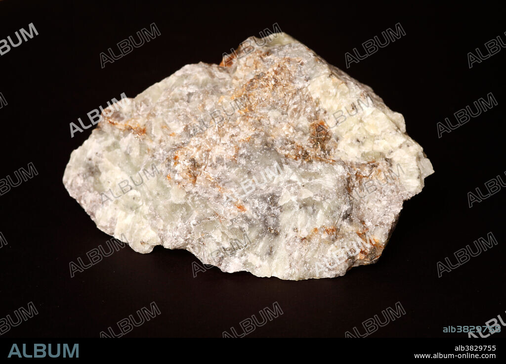 This mineral produces a strong yellow colour when exposed to long wave ultraviolet (UV) light. Photographed under white light. Wernerite is a variation of scapolite. Collected in Grenville Quebec, Canada. Wernerite is considered one of the strongest fluorescent minerals in the long wave. This mineral was named in the early 1800's by Abraham Gottlob Werner (1749-1817) who was a well known German professor of mineralogy.