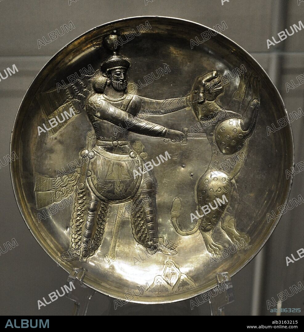 Sasanian Art. Plate with king Shapur III fighting a predator. Silver; chasing, gilding. Iran. 4th century. Found as part of a treasure in Perm Region. Iran. The State Hermitage Museum. Saint Petersburg. Russia.