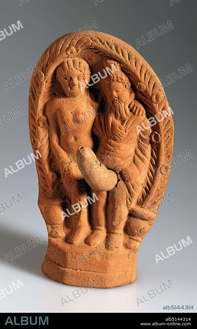 Aphrodite and Priapos in a palm arbour, Clay, pressed into the form, hand modeled, fired (ceramic), Total: Height: 15 cm; Width: 9.8 cm; Depth: 5.4 cm, ceramic, Gods (classical. Mythology), Hellenism, In an arbour, which is made of two vessels with palm fronds, Aphrodite and her son Priapos are standing on a raised base on the left and on the right. The goddess is dressed only with a cloak draped around her hips and falling to the ground. The hair is combined in a curly hairstyle. She has put her left arm around Priapos. This one is bald and bearded. On his head he carries a wreath and a basket (Greek kalathos). He has raised his long robe; an inserted oversized phallus is visible. Aphrodite and Priapos are to be connected as deities of love and desire with fertility cults and are accordingly depicted in a body-stressed manner. As a talisman, such figures were hung up in the house or at the entrance and thus ensured the protection of the two gods. The figure belongs to the group of the so-called Fayum terracottas. In Alexandria, the international, Greek-influenced center of Egypt, lives a multicultural society of Egyptians, Orientals, Greeks, Romans, Jews and others, whose different religious ideas are gradually blending together. Insights into this world of faith are provided by the so-called Fayum terracottas. They are part of the religious household, children's toys, knick-knacks, but also cult symbols, grave goods, pilgrimage images, votive offerings and magical objects for banishing evil forces. They can be found in houses, graves and sanctuaries.