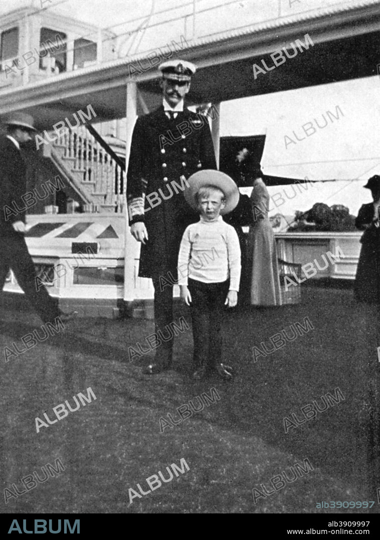 King Haakon VII of Norway (1872-1957) with his son Olav (903-1991), the future King Olav V, 1908. From Queen Alexandra's Christmas Gift Book, Photographs from My Camera, by Queen Alexandra, published by The Daily Telegraph (London, 1908).