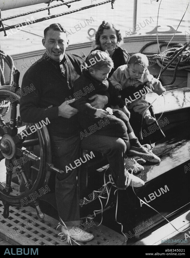 Start World Cruise -- Capt. Irving Johnson, Mrs. Johnson, and their children, Arthur 4, and Robert 11 months, shown here yesterday before they started on a cruise around the world on the schooner "Yankee." This will be their third cruise on the Yankee. The schooner carries a crew of college boys out to see the world. October 30, 1939. (Photo by Wide World Photo).