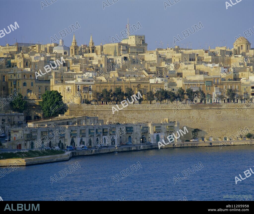 St. Barbara Bastion and Barbierra Wharf, with St. Lucia church and Valletta (Valetta) behind, Malta, Europe.