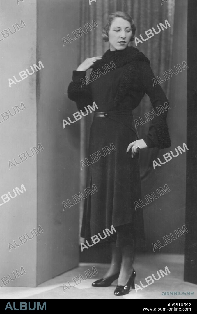In the Image, brown cloth coat and Astracan of the same tone from 1930. Model by Charlotte Revyl.