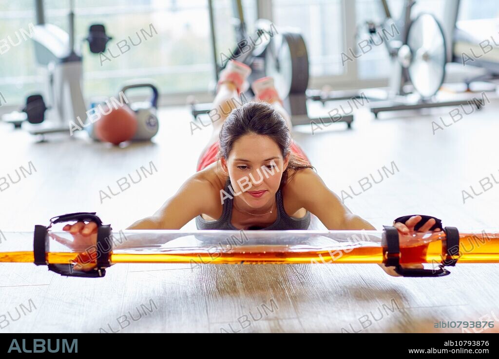 Woman, Muscle training with the SLASH PIPE, Fitness, Gym, Donostia, San Sebastian, Spain, Europe.