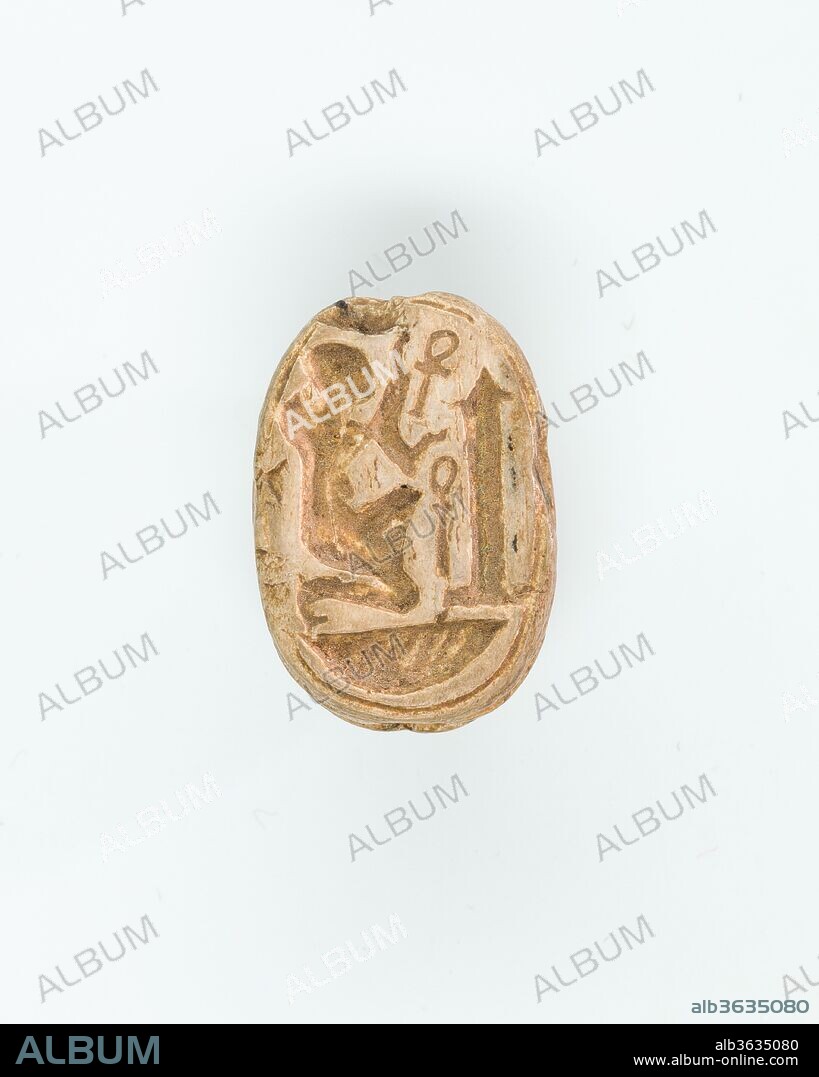Scarab with a kneeling figure before an obelisk. Dimensions: L. 1.5 cm (9/16 in.); W. 1 cm (3/8 in.); H. 0.7 cm (1/4 in.). Dynasty: Dynasty 21-25. Date: ca. 1070-664 B.C..