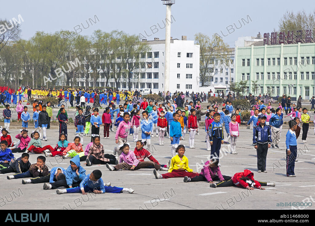 Children practising mass games outside the Grand Theatre, Hamhung, Democratic People's Republic of Korea (DPRK), North Korea, Asia.