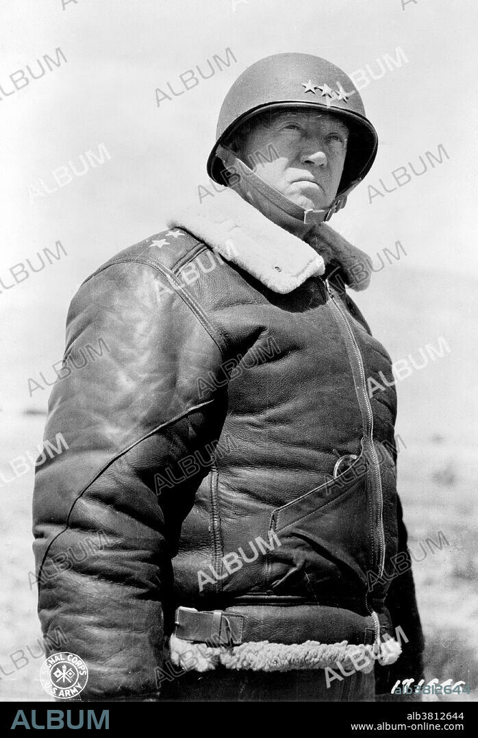Lieutenant General Patton wearing leather jacket and helmet with three stars, March 30, 1943. George Smith Patton, Jr. (November 11, 1885 - December 21, 1945) was a general in the US Army. He joined the newly formed US Tank Corps of the AEF and saw action in WWI. Rising through the ranks, he commanded the US 2nd Armored Division at the time of the US entry into WWII. He led troops into the Mediterranean theater with an invasion of Casablanca during the North African Campaign in 1942. He commanded the Seventh Army during the Invasion of Sicily. He returned to command the Third Army following the Invasion of Normandy in 1944, where he led a highly successful, rapid drive across France and advanced his army into Nazi Germany by the end of the war. His strong emphasis on rapid and aggressive offensive action proved effective. He was regarded highly by his opponents in the German High Command. After the war Patton became the military governor of Bavaria, but was relieved because of his statements on denazification. He died following an automobile accident in 1945 at the age of 60.