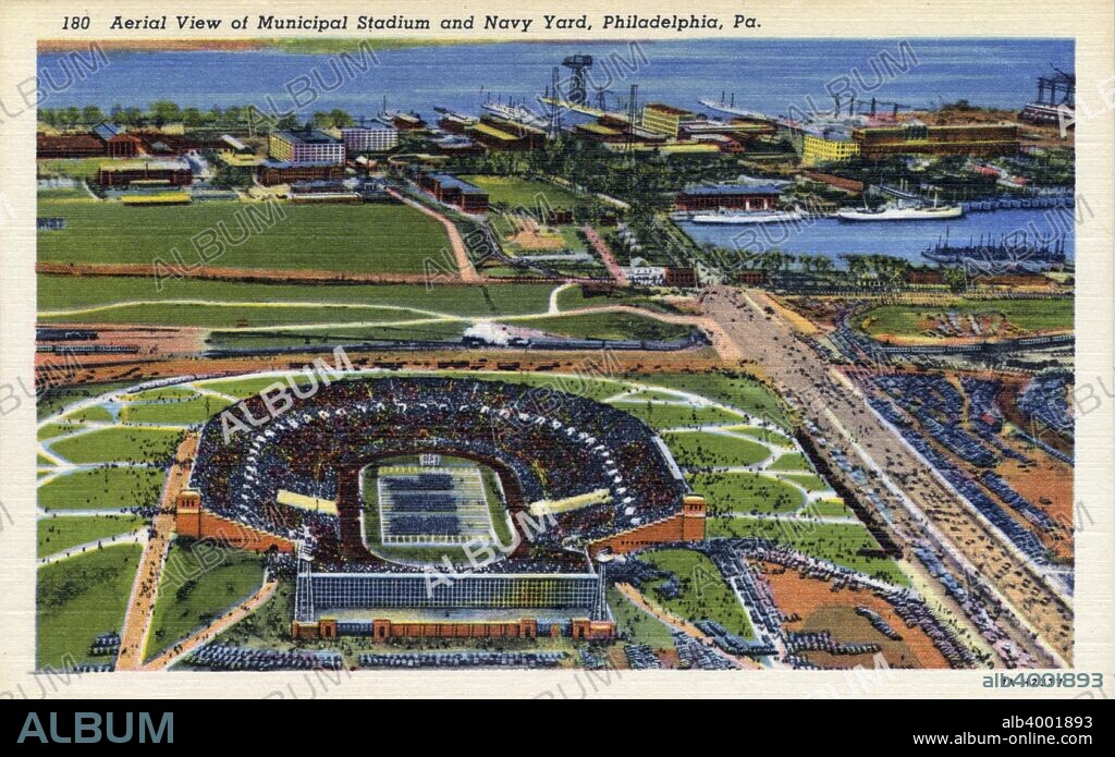 Aerial view of Municipal Stadium and Navy Yard, Philadelphia, Pennsylvania, USA, 1937. Vintage linen postcard. Philadelphia's Municipal Stadium was built in 1925 for the 1926 Sesquicentennial International Exposition. It was home to the Philadelphia Quakers American Football team, who won the American Football League in 1926, its only year of competition. The Philadelphia Eagles of the National Football League (NFL) used Municipal Stadium for a few years in the 1940s but it is best known for being the venue for the annual college football game between the Army and Navy between 1936 and 1979. In 1926 120,557 people packed the stadium to watch Gene Tunney beat Jack Dempsey to win the world heavyweight boxing championship. It was also used as a venue for pop concerts, including the American part of Live Aid in 1985. Municipal Stadium was renamed John F Kennedy Stadium in 1964. By the late 1980s the condition of the stadium was deteriorating and it was condemned in 1989 and demolished three years later. The Philadelphia Naval Shipyard was the first shipyard to be built for the US Navy, serving the Navy from 1801 until its closure in 1995.