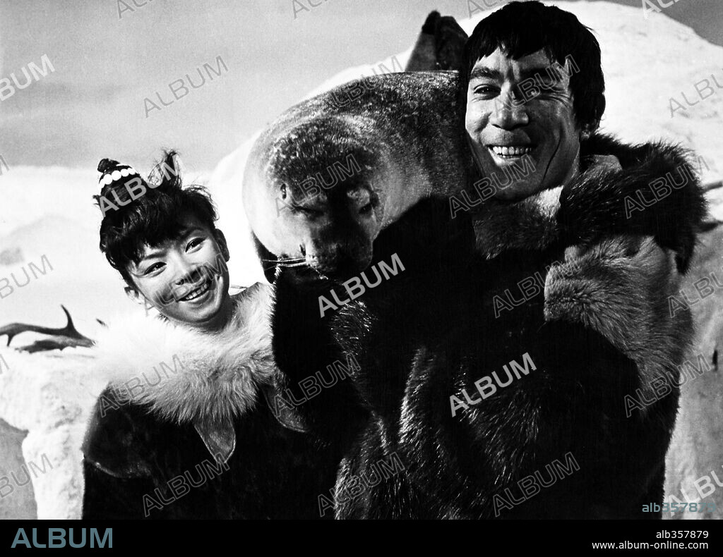 ANTHONY QUINN and YOKO TANI in THE SAVAGE INNOCENTS, 1960, directed by NICHOLAS RAY. Copyright PARAMOUNT PICTURES.
