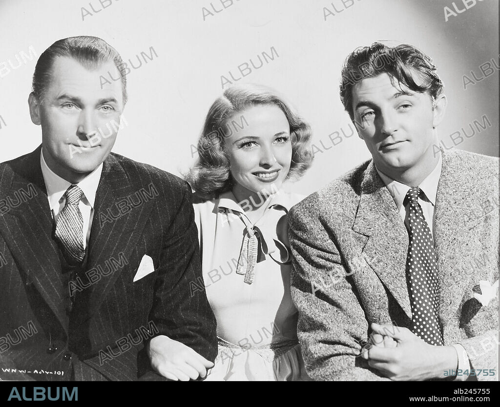 BRIAN AHERNE, LARAINE DAY and ROBERT MITCHUM in THE LOCKET, 1946, directed by JOHN BRAHM. Copyright RKO.