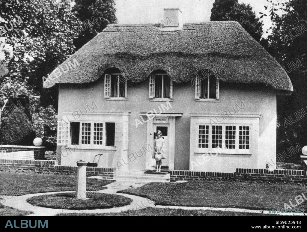 Princess Elizabeth, future Queen Elizabeth II of Great Britain, Windsor, 1930s. Elizabeth (b1926) as a child on the steps of Y Bwthn Bach (The Little House), the playhouse given to her by the people of Wales.