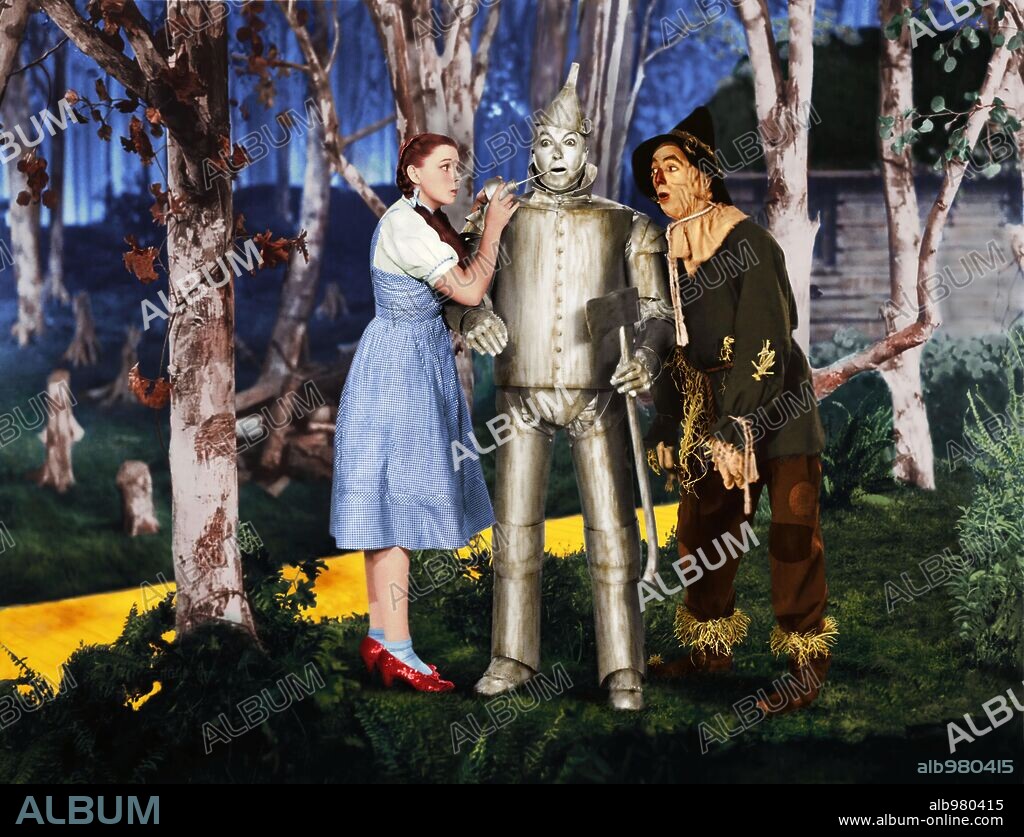 JACK HALEY, JUDY GARLAND and RAY BOLGER in THE WIZARD OF OZ, 1939, directed by VICTOR FLEMING. Copyright M.G.M.