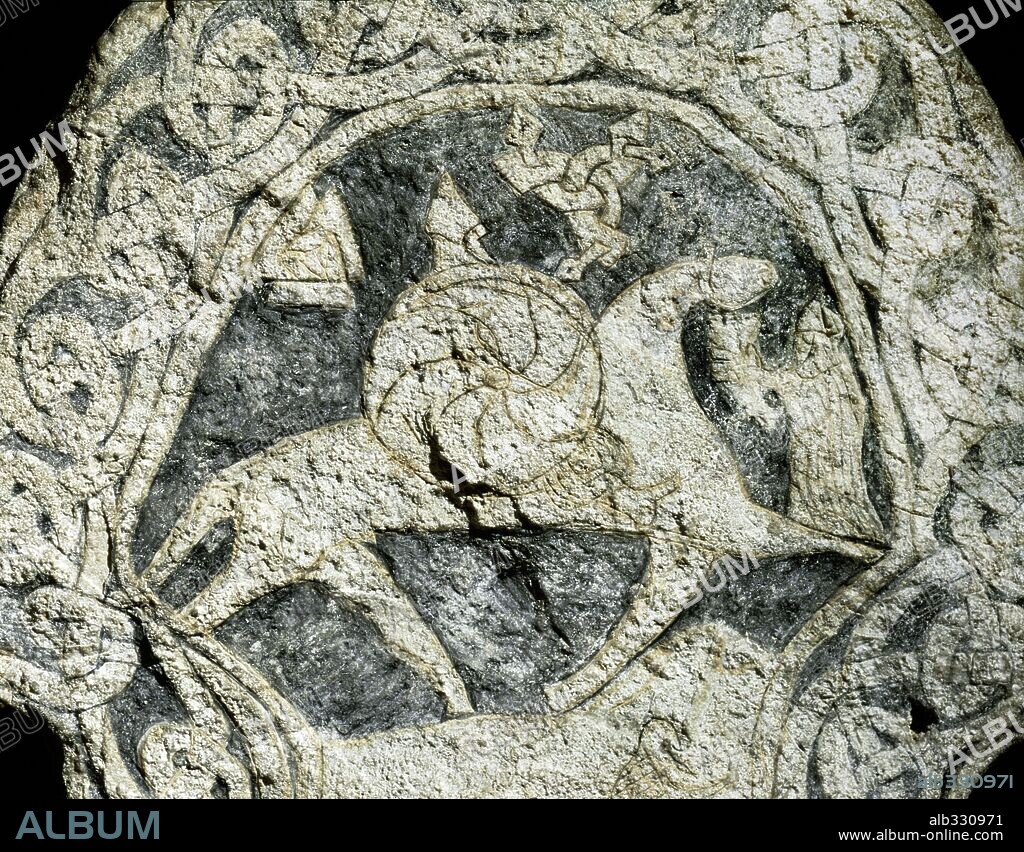 Viking picture stone from Lillbjors Gotland, VIIIth century with God Wotan on horse Sleipnir assisted by Walkyrie.