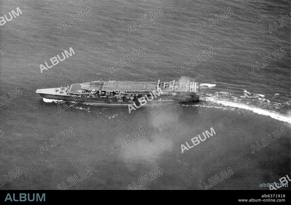 Kaga was an aircraft carrier built for the Imperial Japanese Navy (IJN) and was named after the former Kaga Province in present-day Ishikawa Prefecture. Originally intended to be one of two Tosa-class battleships, Kaga was converted under the terms of the Washington Naval Treaty to an aircraft carrier as the replacement for the battlecruiser Amagi, which had been damaged during the 1923 Great Kanto earthquake. Kaga was rebuilt in 193335, increasing her top speed, improving her exhaust systems, and adapting her flight decks to more modern, heavier aircraft.<br/><br/>. Kaga's aircraft first supported Japanese troops in China during the Shanghai Incident of 1932 and participated in the Second Sino-Japanese War in the late 1930s. With other carriers, she took part in the Pearl Harbor raid in December 1941 and the invasion of Rabaul in the Southwest Pacific in January 1942. The following month her aircraft participated in a combined carrier airstrike on Darwin, Australia, helping secure the conquest of the Dutch East Indies by Japanese forces.<br/><br/>. Following repairs, Kaga rejoined the 1st Air Fleet for the Battle of Midway in June 1942. After bombarding American forces on Midway Atoll, Kaga and three other IJN carriers were attacked by American aircraft from Midway and the carriers Enterprise, Hornet, and Yorktown. Dive bombers from Enterprise severely damaged Kaga; when it became obvious she could not be saved, she was scuttled by Japanese destroyers to prevent her from falling into enemy hands.<br/><br/>. The loss of four large attack carriers, including Kaga at Midway, was a crucial setback for Japan, and contributed significantly to Japan's ultimate defeat. In 1999, debris from Kaga including a large section of the hull was located on the ocean floor at a depth in excess of 5,000 meters (16,404 ft); 350 miles (560 km) northwest of Midway Island. The main part of the carrier's wreck has not been found.