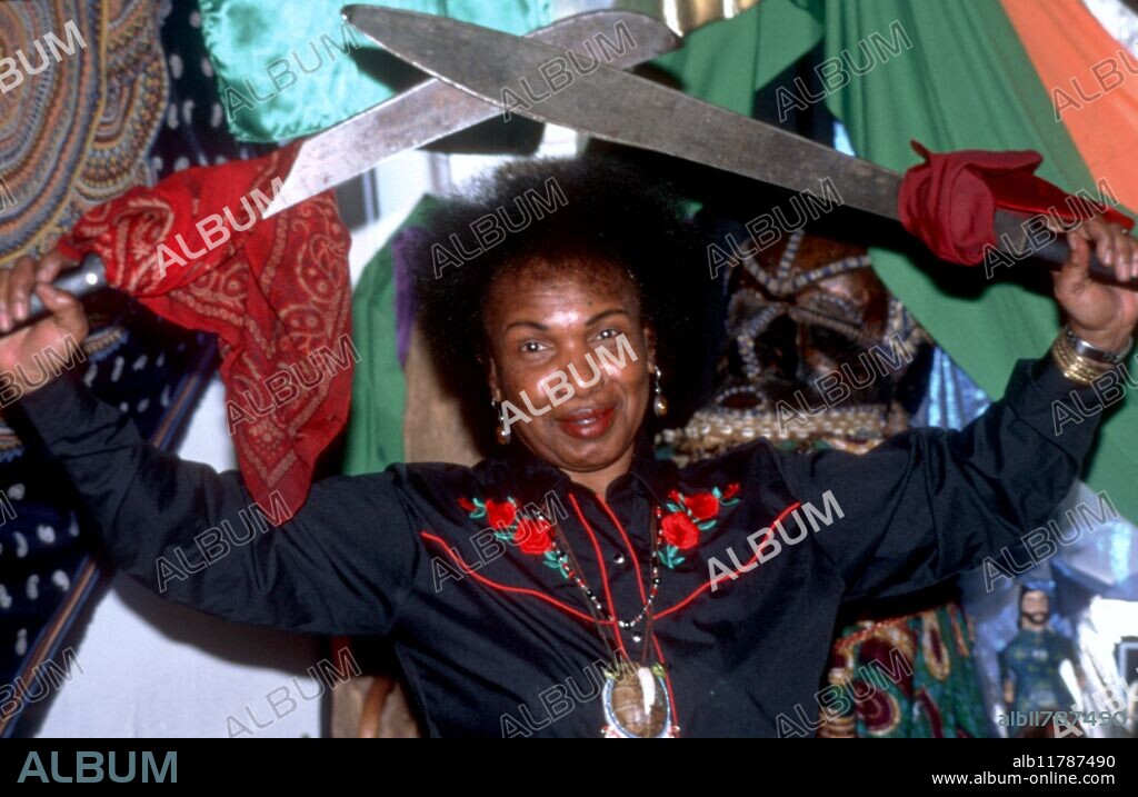 Mambo (priestess) Miriam in Voodoo Spiritual Temple, New Orleans, Louisiana, USA. She is posing as incorporating the Voodoo loa (deity) Ogoun, powerful warrior god. - © TopFoto / Fortean.