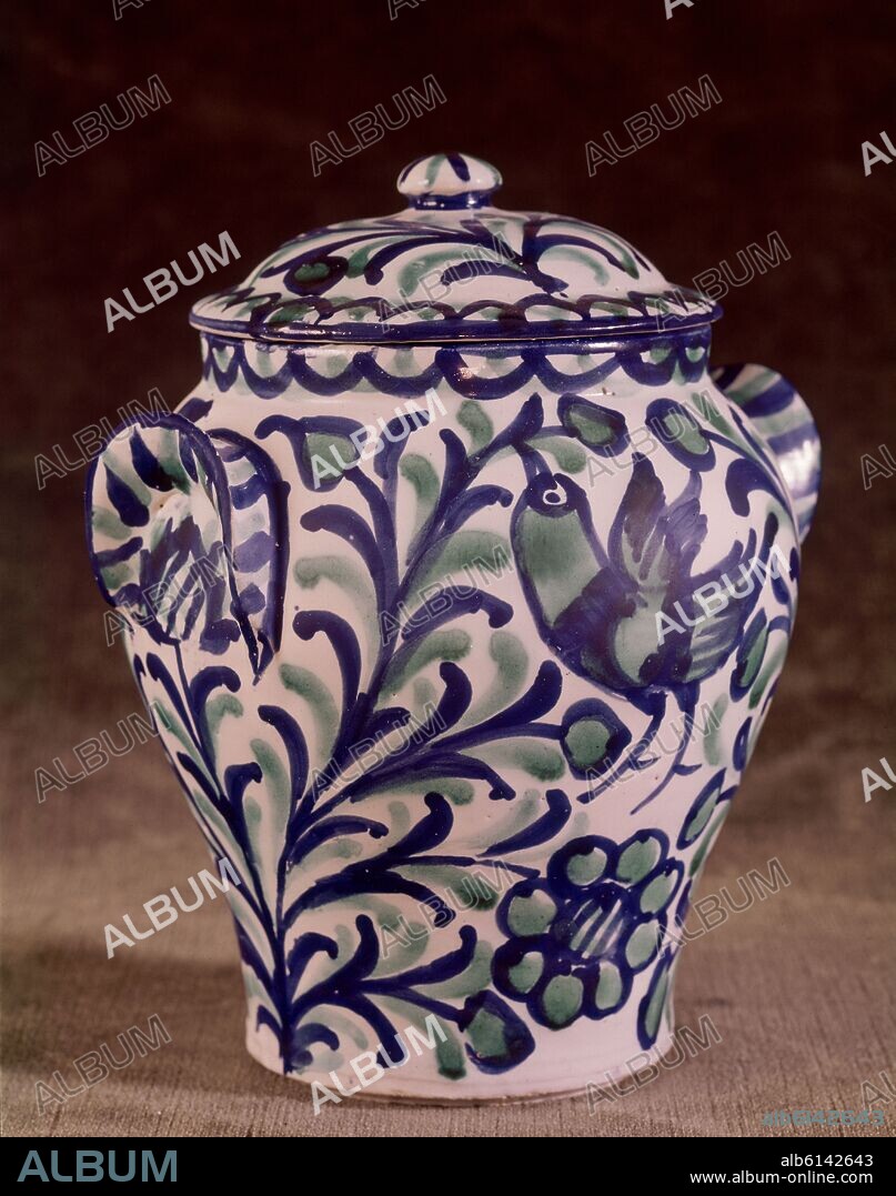 ORZA VIDRIADA - DECORADA CON PAJARO Y FLOR DE PATATA EN AZUL Y VERDE - SIGLO XX.