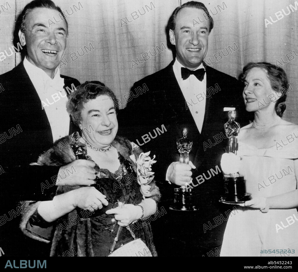Oscar Principals -- Josephine Hull (left foreground), George Sanders (back right) and Helen Hayes hold Academy Award Oscars they received in ceremony last night. Miss Hull won best supporting actress for "Harvey." Sanders was named best supporting actor for "All About Eve." Miss Hayes accepted the award for Jose Ferrer, top male acting winner, who is in New York, and Dean Jagger (left) made the formal presentation to Miss Hull. March 30, 1951. (Photo by AP Wirephoto).