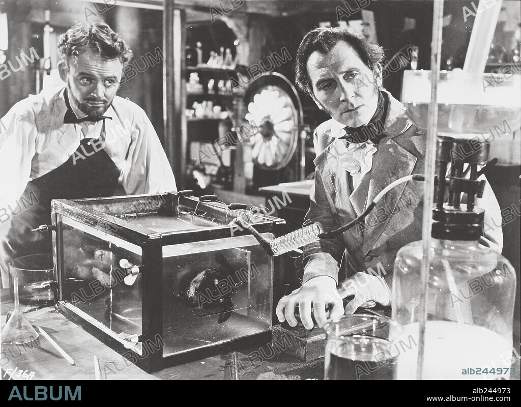 PETER CUSHING and ROBERT URQUHART in THE CURSE OF FRANKENSTEIN, 1957, directed by TERENCE FISHER. Copyright HAMMER FILM PRODUCTIONS.