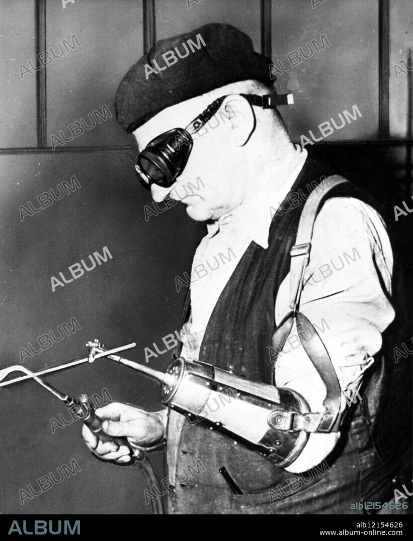 Remploy Ltd. With a little adaption this one handed man is able to do a job of welding alongside any other worker . He is one of the lucky ones employed in the Remploy Ltd enterprises . London. 6th December 1968.