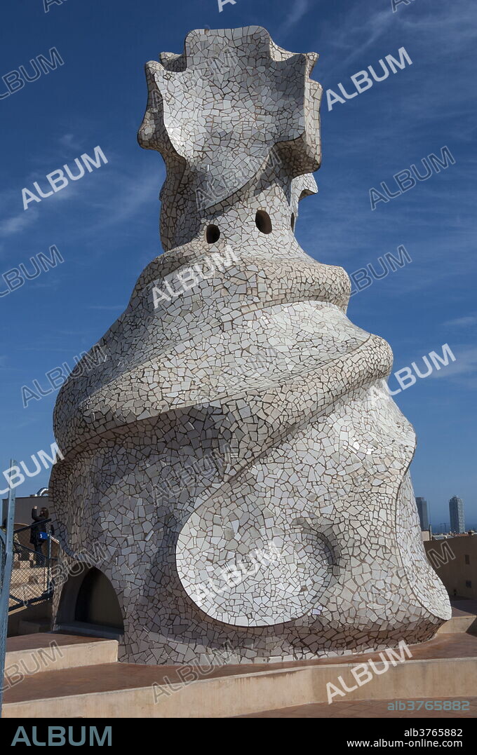 Large chimney inlaid with random cut white glazed tile, roof of La Pedrera (Casa Mila), an apartment house designed by Antonio Gaudi, UNESCO World Heritage Site, Passeig de Gracia, Barcelona, Catalunya, Spain, Europe.