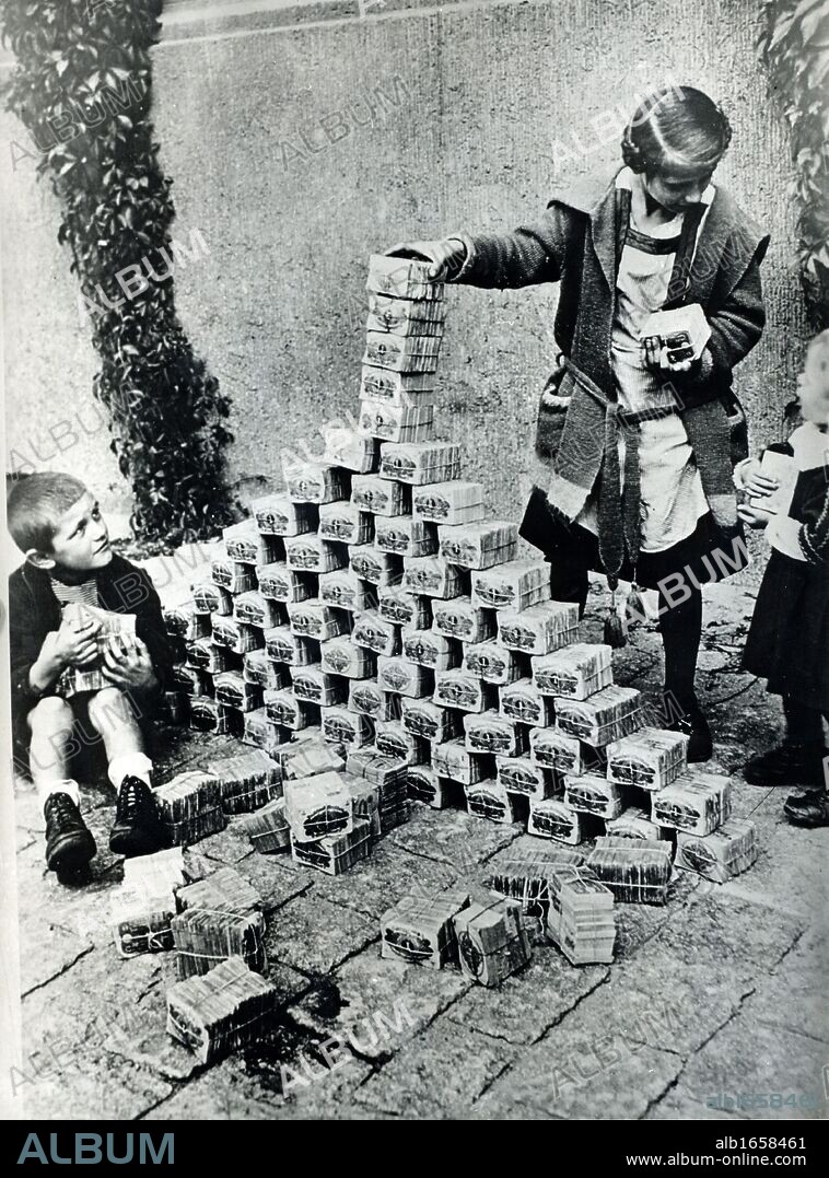 Hyperinflation of German currency, 1923. The depreciation in value of money made paper notes so worthless that children used them as building blocks.