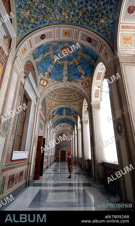 Swiss guard in the first Loggia of Raphael (Raffaello Sanzio) at the Apostolic Palace, Vatican (2005) (Palais Apostolique - Loges de Raphael)
Actually the paintings of the first loggia have been made during the 19th century, covering the old ones executed by Raphael's workshop.
The walls are decorated with trompe-l'oeil, grotesques fanciful arabesques enlivened with a wide variety of plants, flowers and animal figures modeled after ancient Roman wall paintings. 
-The grandiose and solemn Apostolic Palace is a secretive place, forbidden to the public and jealously guarded by the Swiss Guard. It hosts the Holy See administration, the Church's spiritual authorities and before all, the apartments of the Pontiff Sovereign.