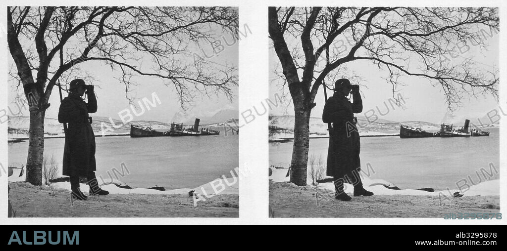 Narvik – A guard at the port of Narvik . A sunken steamer is in the background.