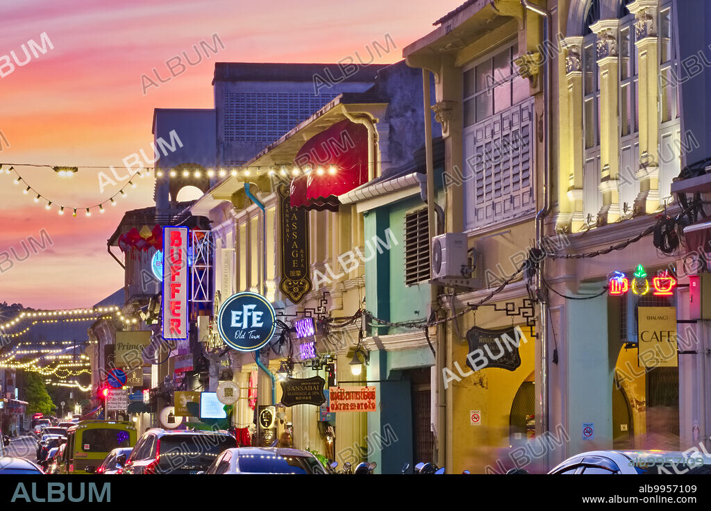 Thailand: Dusk falls over tourism-related establishments in Thalang Road in the Old Town area of Phuket Town (Phuket City), Phuket, the road, with its numerous Sino-Portuguese style houses has become a major tourist attraction, with many of the houses converted into restaurants cafes and guest houses.