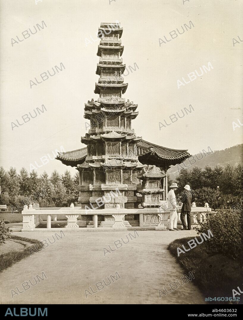 South Korea, Two European men chat together beneath an ornate pagoda-style monument in a public garden. Original manuscript caption: Seoul - Public Gardens, circa 1920. 1998/028/1/1/251.