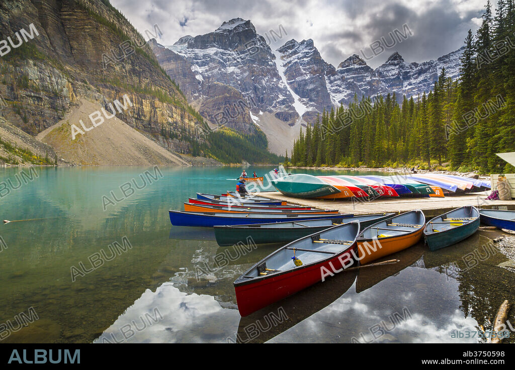 Tranquil setting of rowing boats on Moraine Lake, Banff National Park, UNESCO World Heritage Site, Canadian Rockies Alberta, Canada, North America.