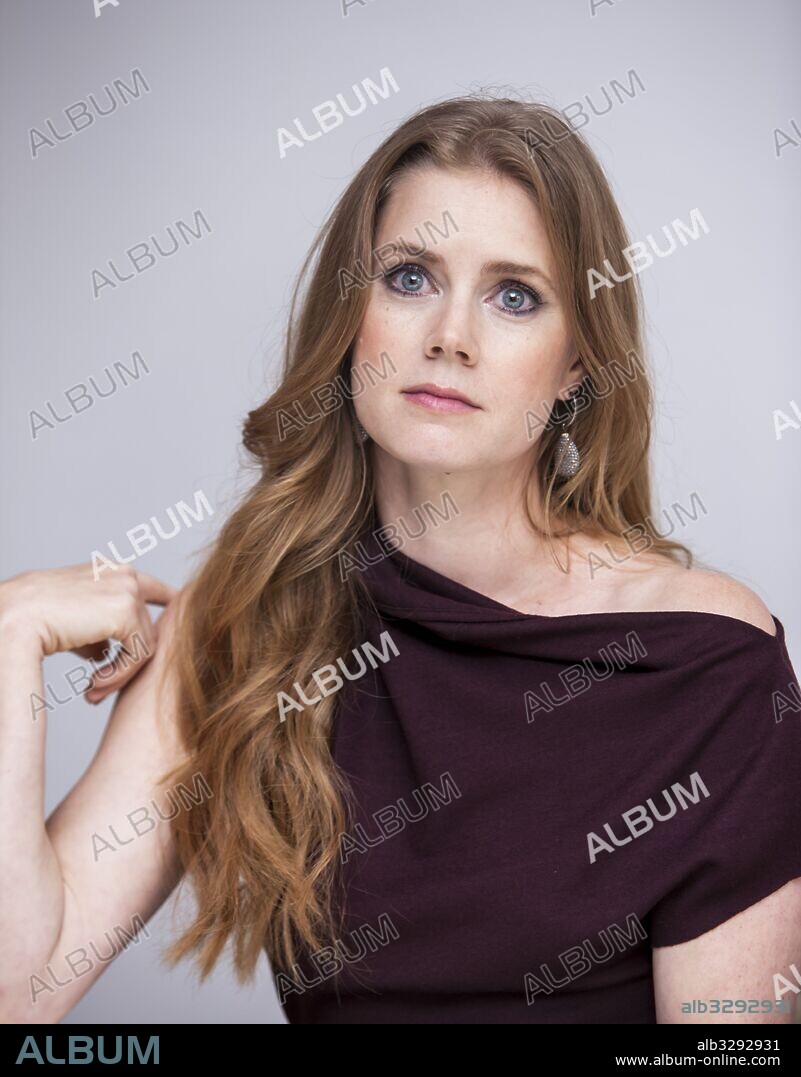 AMY ADAMS. September 15, 2012 - Hollywood, California, U.S. - AMY ADAMS promotes 'Trouble With The Curve' at the Four Seasons Hotel. Amy Lou Adams (born August 20, 1974) is an American actress and singer. She was named one of 100 most influential people by Time magazine in 2014 and is among the highest-paid actresses in the world. She has won two Golden Globe Awards and has been nominated for five Academy Awards, and six BAFTA Awards. Adams began her career on stage performing in dinner theater and went on to make her feature film debut in Drop Dead Gorgeous (1999). After moving to Los Angeles, she made several appearances on television and in B-movies, before starring in Steven Spielberg's 2002 biopic Catch Me If You Can. Adams's breakthrough role came in the 2005 independent film Junebug, in which her portrayal of a young pregnant woman earned her an Academy Award for Best Supporting Actress nomination. In 2007, she starred as a princess in the commercially successful Disney musical film Enchanted. Adams received three more Oscar nominations for her supporting roles in Doubt (2008), The Fighter (2010), and The Master (2012). She played reporter Lois Lane in the 2013 superhero film Man of Steel and a troubled con artist in David O. Russell's film American Hustle; for the latter, she won a Golden Globe Award and was nominated for an Academy Award for Best Actress. She won a second consecutive Golden Globe Award for portraying artist Margaret Keane in the comedy-drama Big Eyes (2014). In 2016, Adams reprised the role of Lois in Batman v Superman: Dawn of Justice, and garnered acclaim for her performances in the science fiction film Arrival and the thriller Nocturnal Animals. Disenchanted (2018), Justice League (2017. 15/09/2012