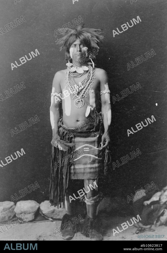 EDWARD SHERIFF CURTIS. Snake dancer in costume, c1900. Hopi snake dancer, full-length portrait, standing, facing front.