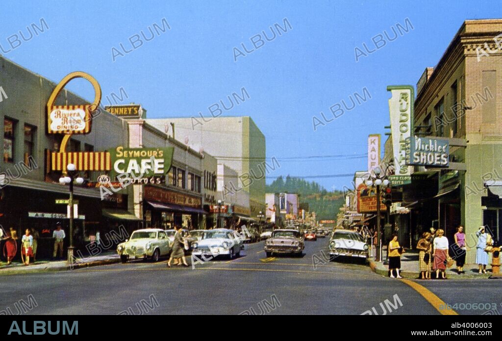 Willamette Street, Eugene, Oregon, USA, 1958. Street scene showing cars and building facades.