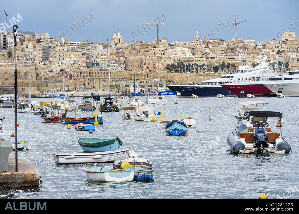 Senglea neighborhood marina (Isla) and Valletta city on the background, Republic of Malta, Europe.
