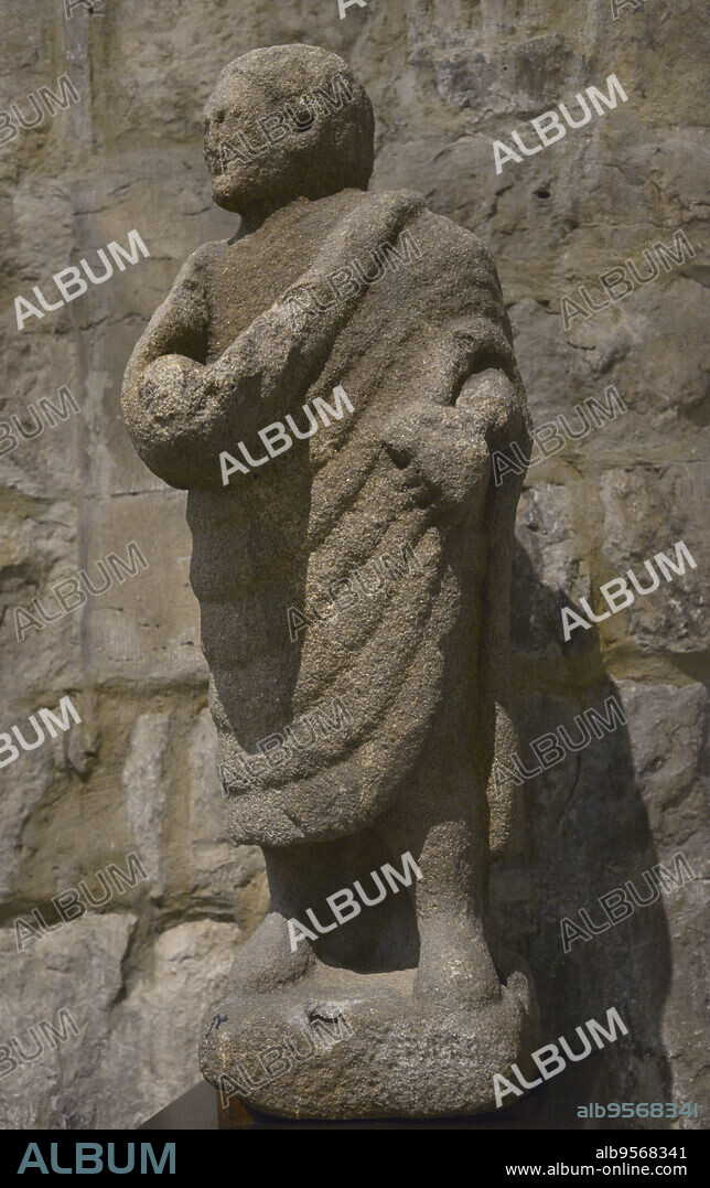 Roman statue depicting a man in toga. Granite. Provenance unknown. In the 16th century it was placed at the mouth of the Douro River, Portugal. Carmo Archaeological Museum. Lisbon, Portugal.