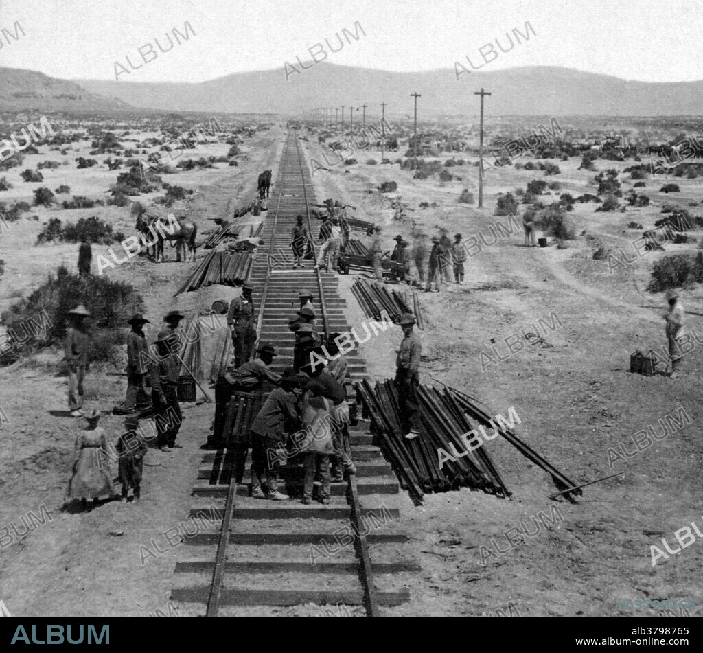 Central Pacific railroad track construction, including Chinese railroad workers. The Central Pacific Railroad is the former name of the railroad network built between California and Utah, US, that built eastwards from the West Coast in the 1860s, to complete the western part of the "First Transcontinental Railroad" in North America. It is now part of the Union Pacific Railroad. Cropped stereograph by Alfred A. Hart.